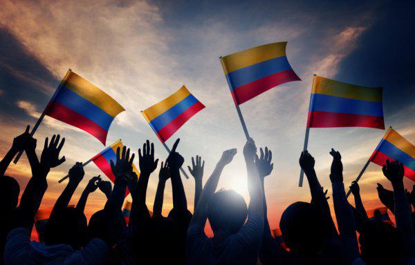 depositphotos_63091169-stock-photo-people-holding-flags-of-colombia